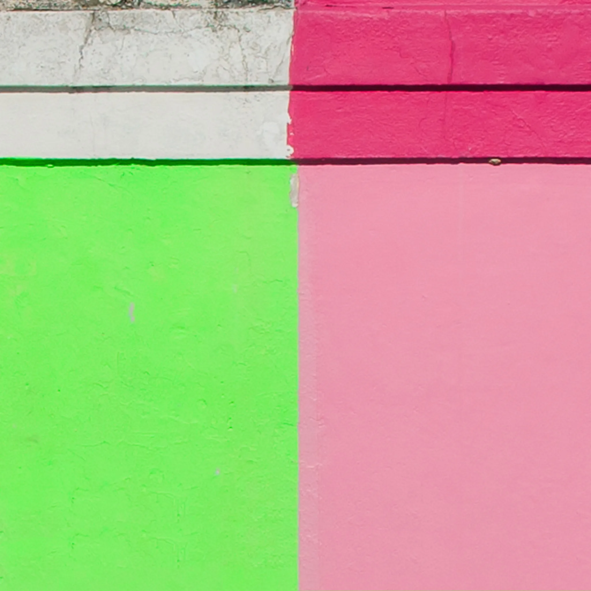 Green and pink walls divided by sharp horizontal lines. Green and pink walls divided by sharp horizontal lines.